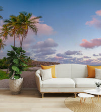 Mural wallpaper of palm trees and ocean at golden hour.

