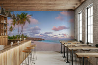 Quiet sunset beach mural with leaning palm silhouettes.

