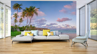 Sunset sky wallpaper mural over calm tropical ocean.

