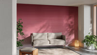 Cherry Blossom Panel wallpaper mural in pink ombre behind a beige sofa and lantern lamp in a plant-filled living room