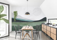 Galactic Harmony wallpaper mural of green hills and faint planets behind a dining table in a kitchen