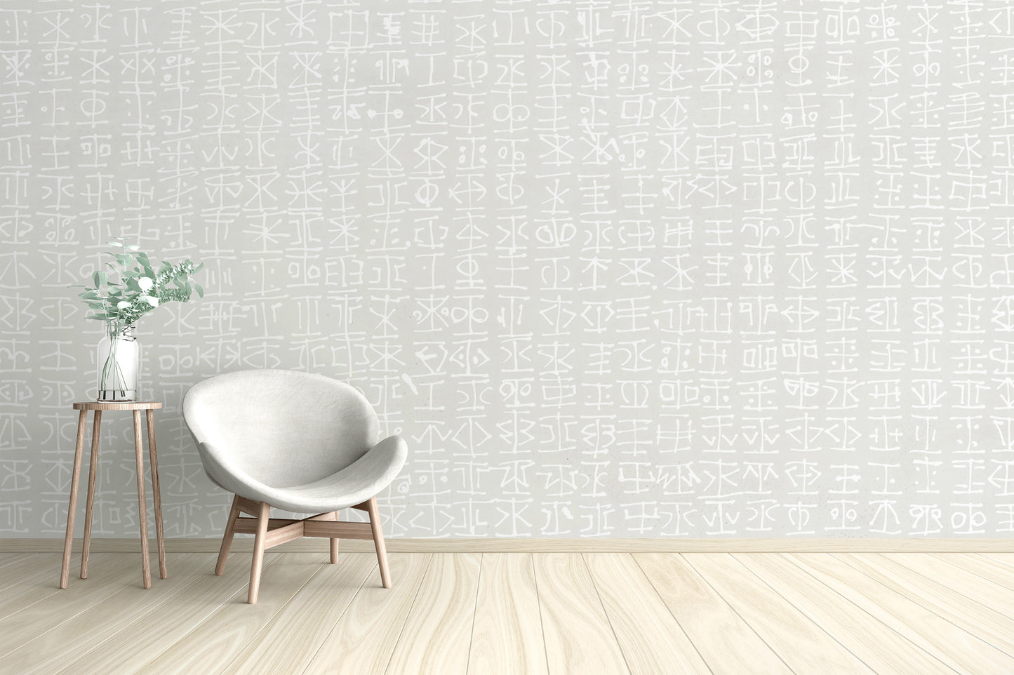 White tribal motif on a light grey wallpaper mural design.
