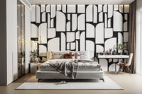 Monochrome Mosaic Tiles wallpaper mural in black and white behind a white bed and vanity in a chic bedroom