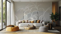 Moon and Grass wallpaper mural in soft grey behind a white sofa, orange pouf and round wood coffee table