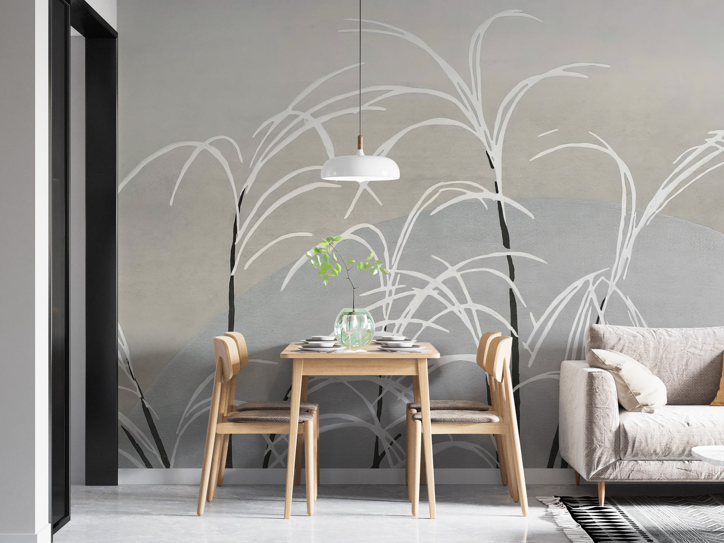 Moon and Grass wallpaper mural in muted grey behind a small wood dining table and grey sofa with pendant light