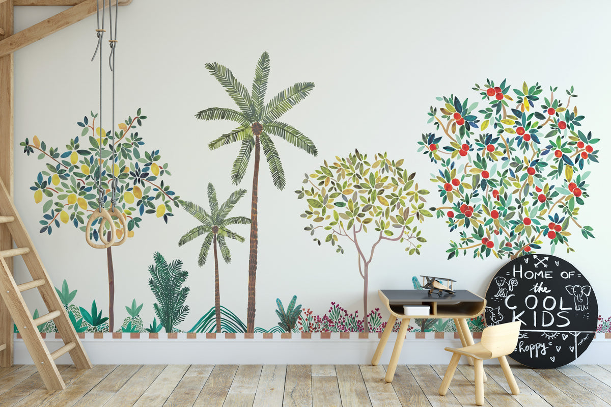 Colorful Tree Wall mural with lemon and berry trees in a kids room with a black desk and small chair
