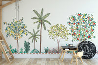 Colorful Tree Wall mural with lemon and berry trees in a kids room with a black desk and small chair