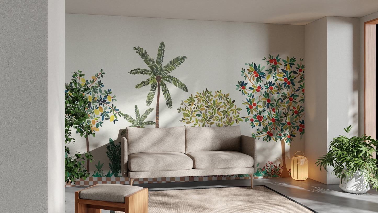 Colorful Tree Wall mural of green palms and red-fruit trees above a taupe sofa in a bright living room
