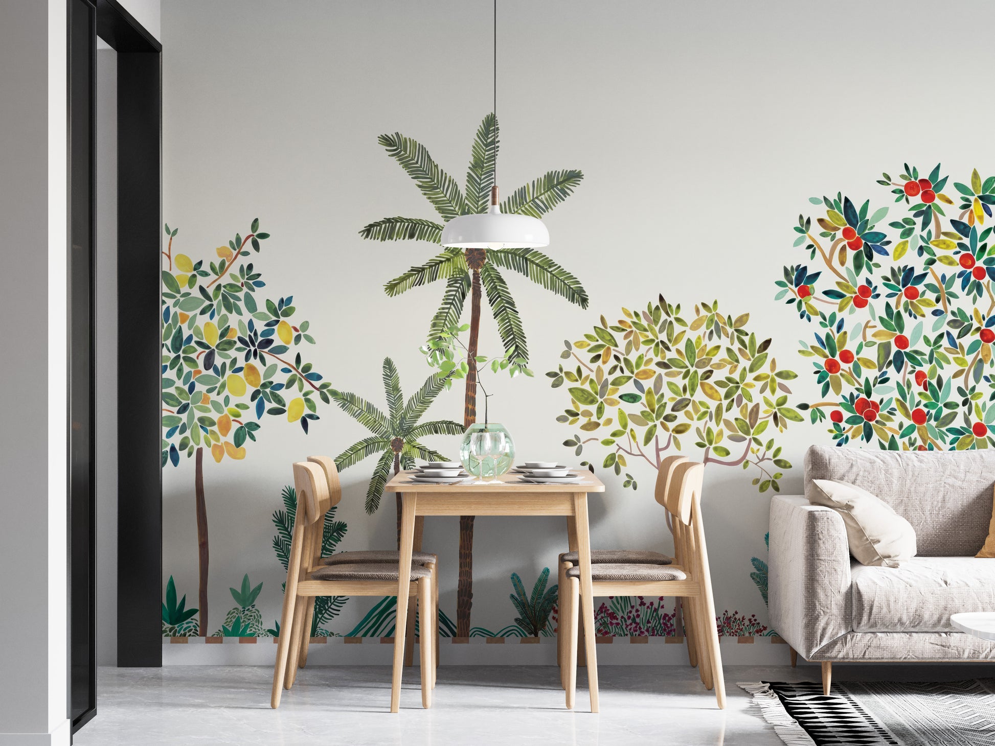 Colorful Tree Wall mural with palm and berry trees behind a wooden dining table and grey sofa