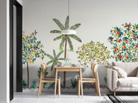 Colorful Tree Wall mural with palm and berry trees behind a wooden dining table and grey sofa