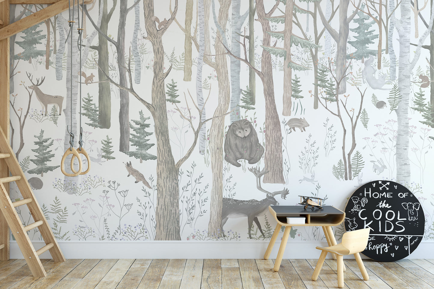 Mystical Forest Scene wallpaper mural with owl and deer in birch woods behind a black play desk in a kids loft bedroom
