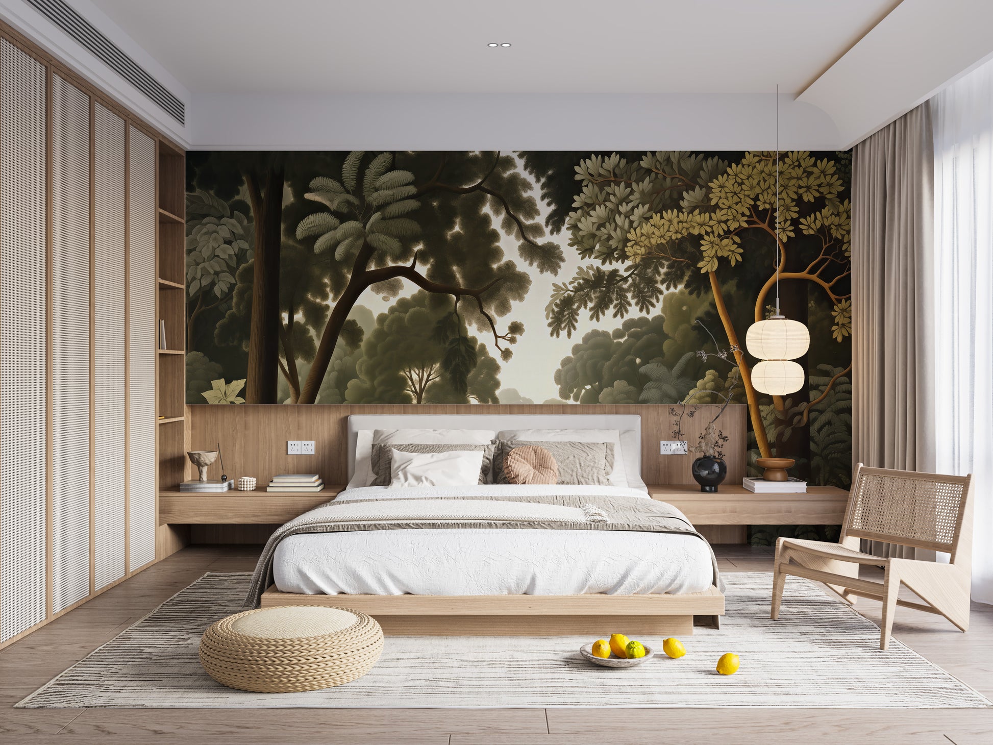 Woodcut Green Nature Botanical wallpaper of a leafy green landscape above a low platform bed and rattan chair in a bedroom