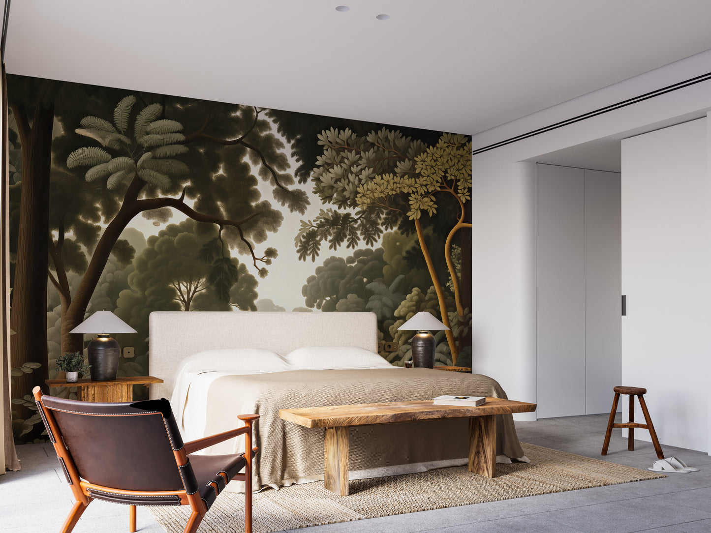Woodcut Green Nature Botanical wallpaper of a dark green forest behind a beige upholstered bed in a modern bedroom