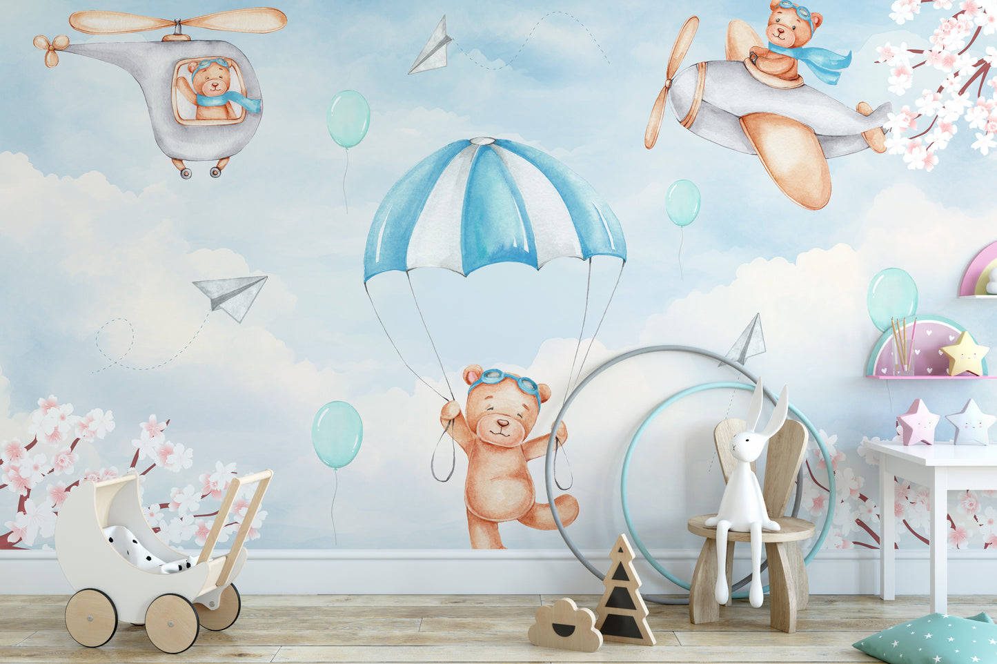 Dreamy Sky Adventure wallpaper mural with parachuting teddy bears in a nursery with wooden toy pram and star shelf