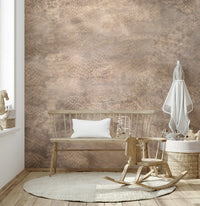 Metallic snakeskin wallpaper with rose gold hues for luxurious and modern interiors.