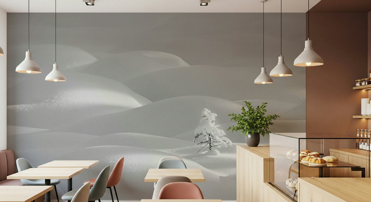 Snowscape Serenity wallpaper mural of white snow hills on a cafe wall with pendant lights, tables and pastries