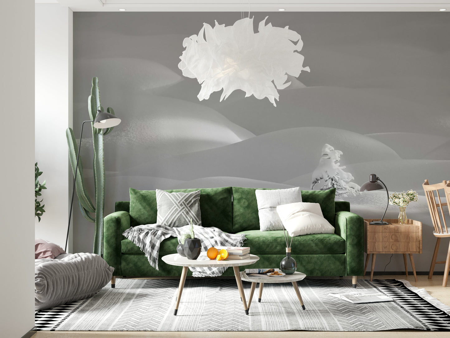 Snowscape Serenity wallpaper mural with pale snow drifts behind a green velvet sofa in a bright living room