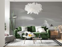 Snowscape Serenity wallpaper mural with pale snow drifts behind a green velvet sofa in a bright living room