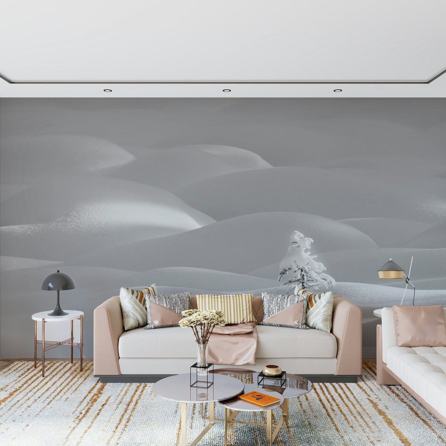 Snowscape Serenity wallpaper mural of snowy hills and a frosted pine behind a blush and cream sofa living room