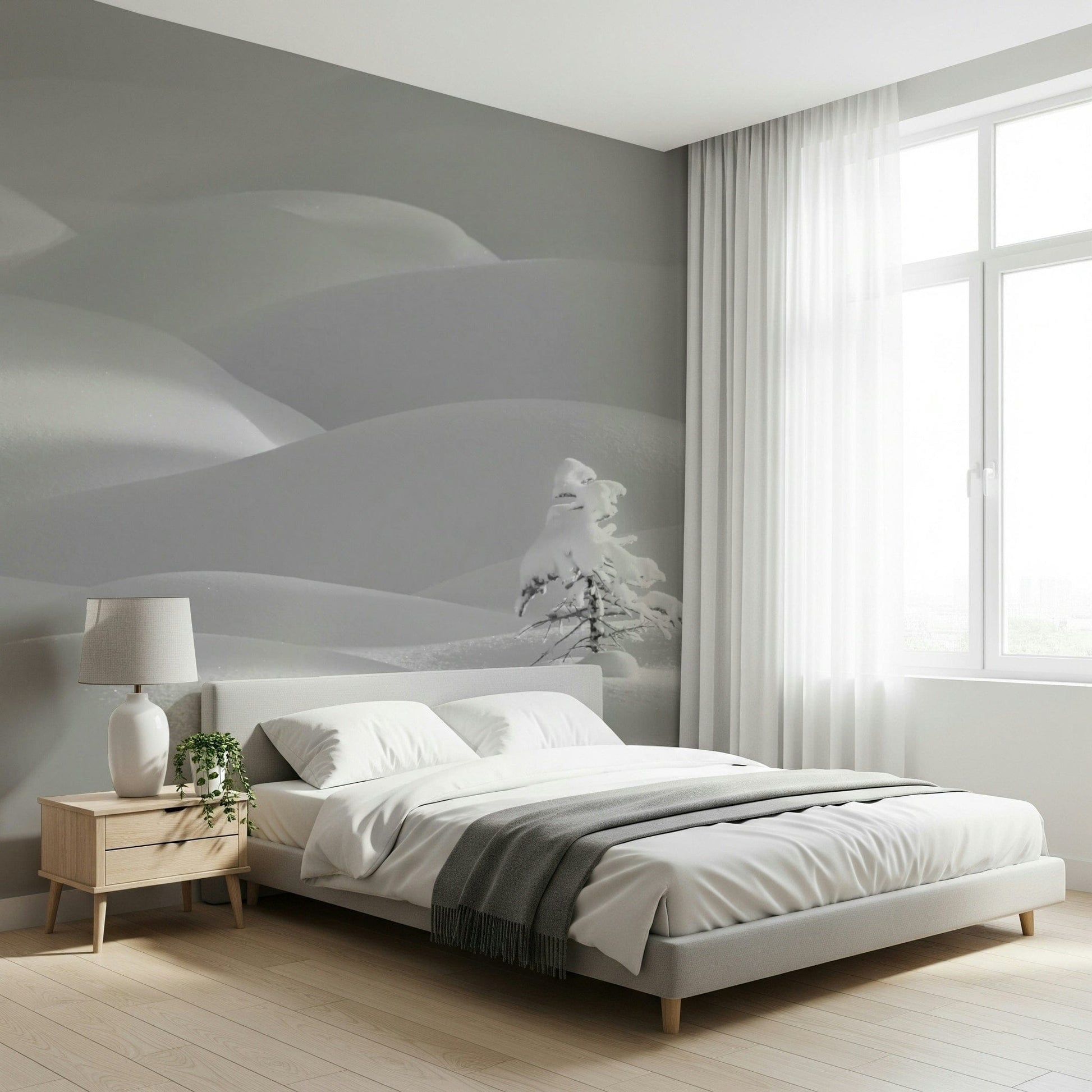 Snowscape Serenity wallpaper mural of gray winter snowdrifts behind a gray upholstered bed in a calm bedroom