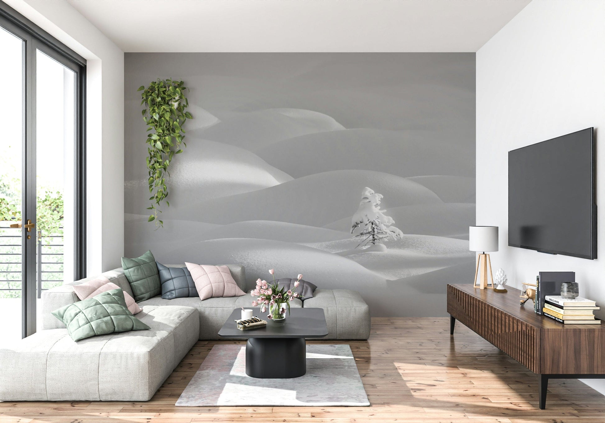 Snowscape Serenity wallpaper mural of white snow hills behind a cream sectional and wall-mounted TV living room