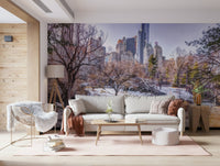 Snowy Central Park mural with a white sofa, fluffy sheepskin chair and tripod lamp on a pink rug