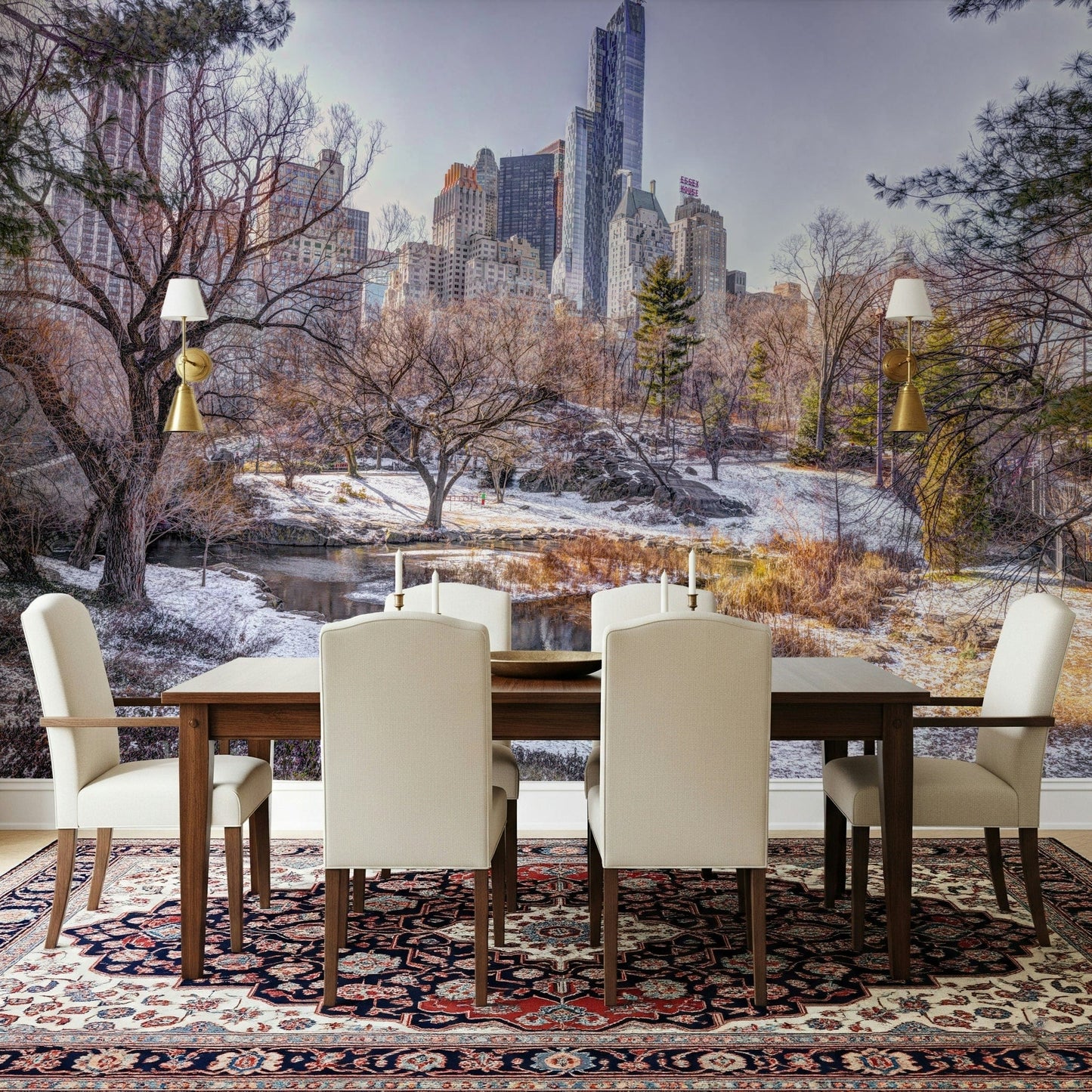 Snowy Central Park mural over a wood dining table and cream chairs on a red Persian rug with wall sconces