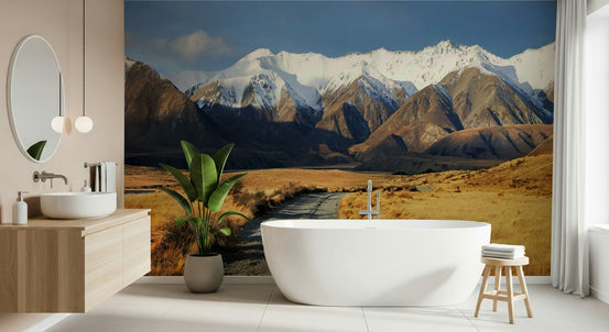 Snowy Peaks Path wallpaper mural of snowcapped mountains and a gravel valley path behind a freestanding bathtub