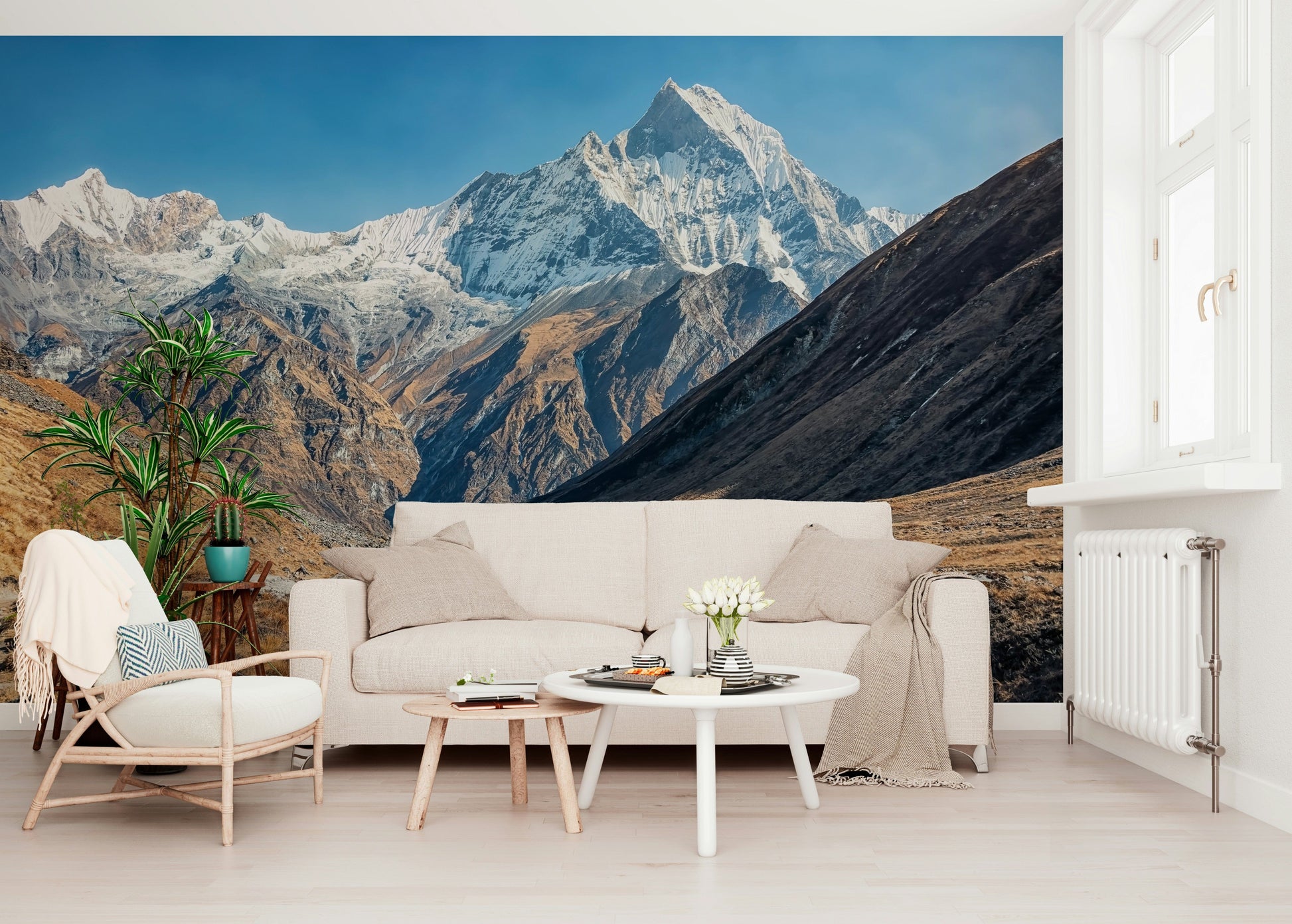 Home office backdrop with snowy mountains and quiet sky mural behind a desk