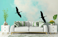An artistic elegant crane mural on minimalist wallpaper.


