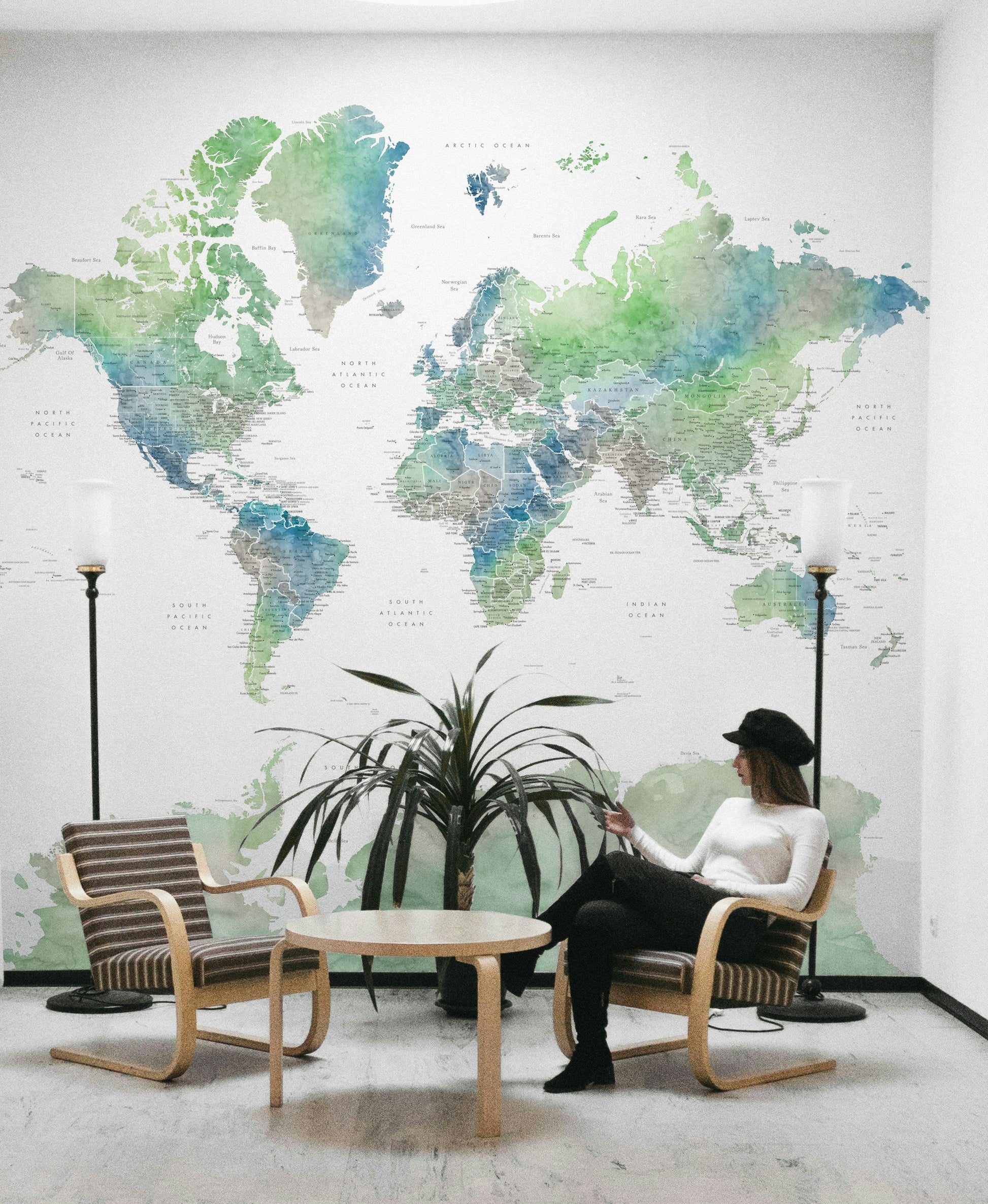 Soft green watercolor world map wallpaper for walls


