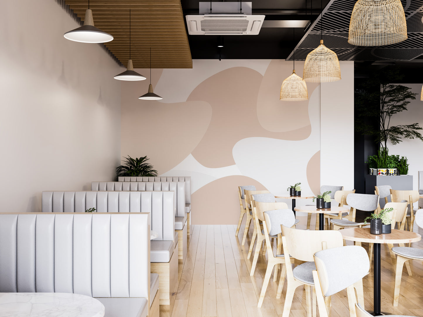 Soft Pastel Abstract wallpaper mural in blush shapes along white booth seating in a modern cafe with rattan lights