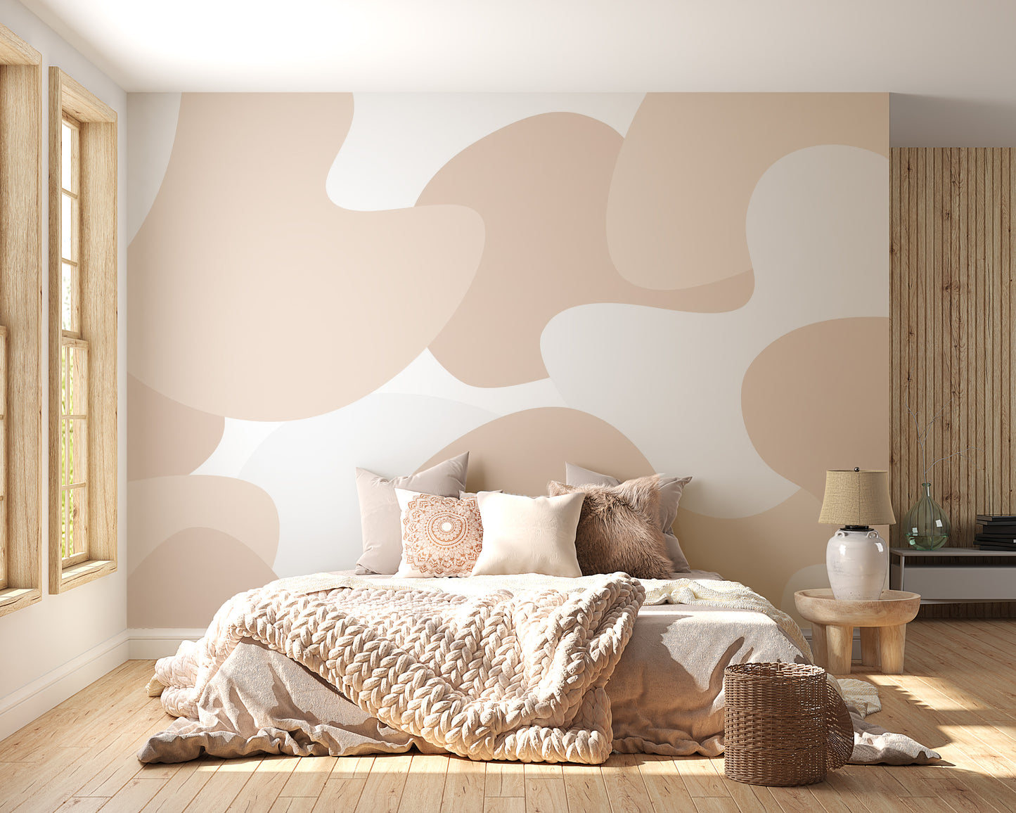 Soft Pastel Abstract wallpaper mural with blush and cream organic shapes above a cozy bed in a warm bedroom