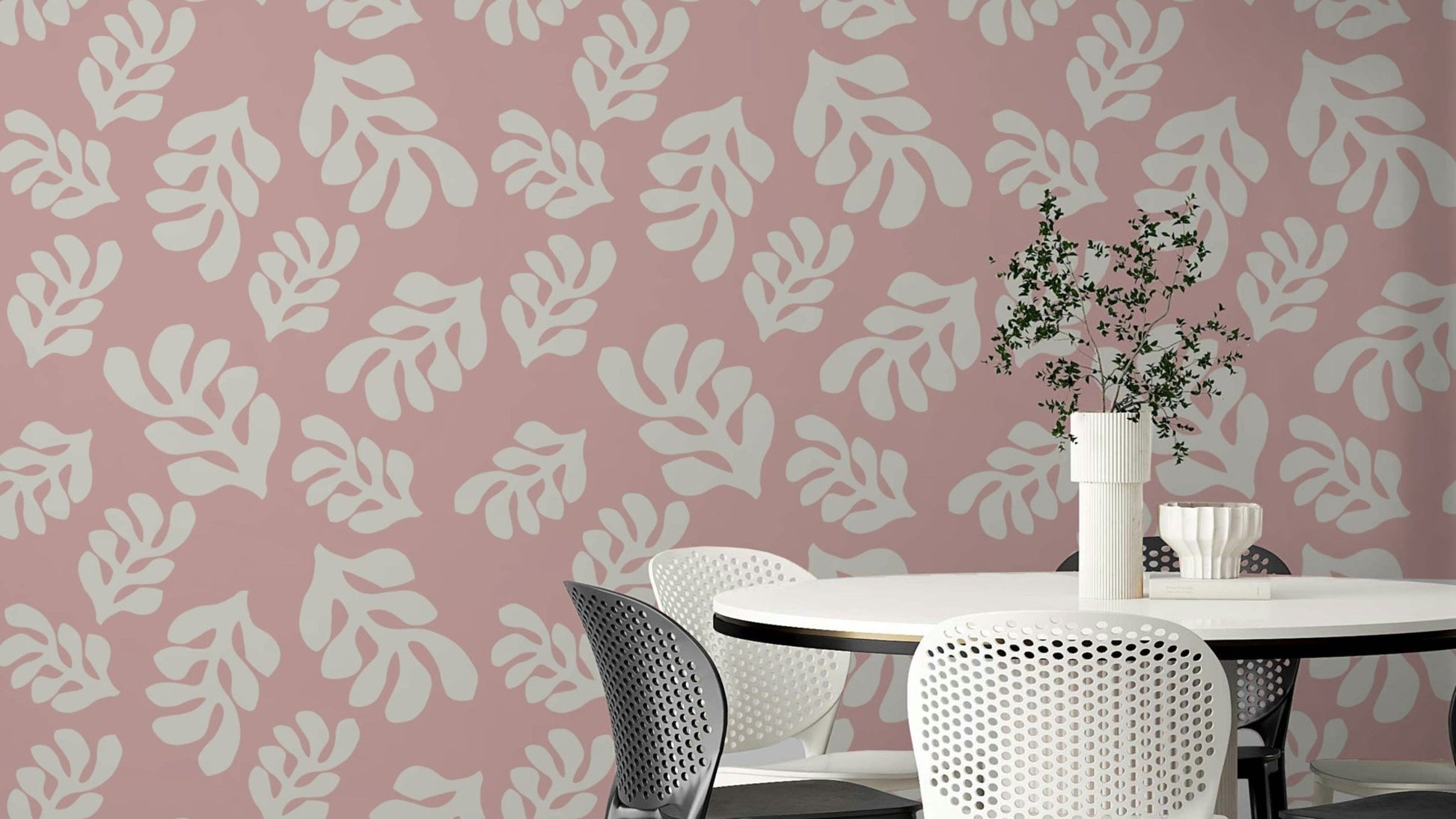 The background is a soft, light color, making the pink leaves stand out.

