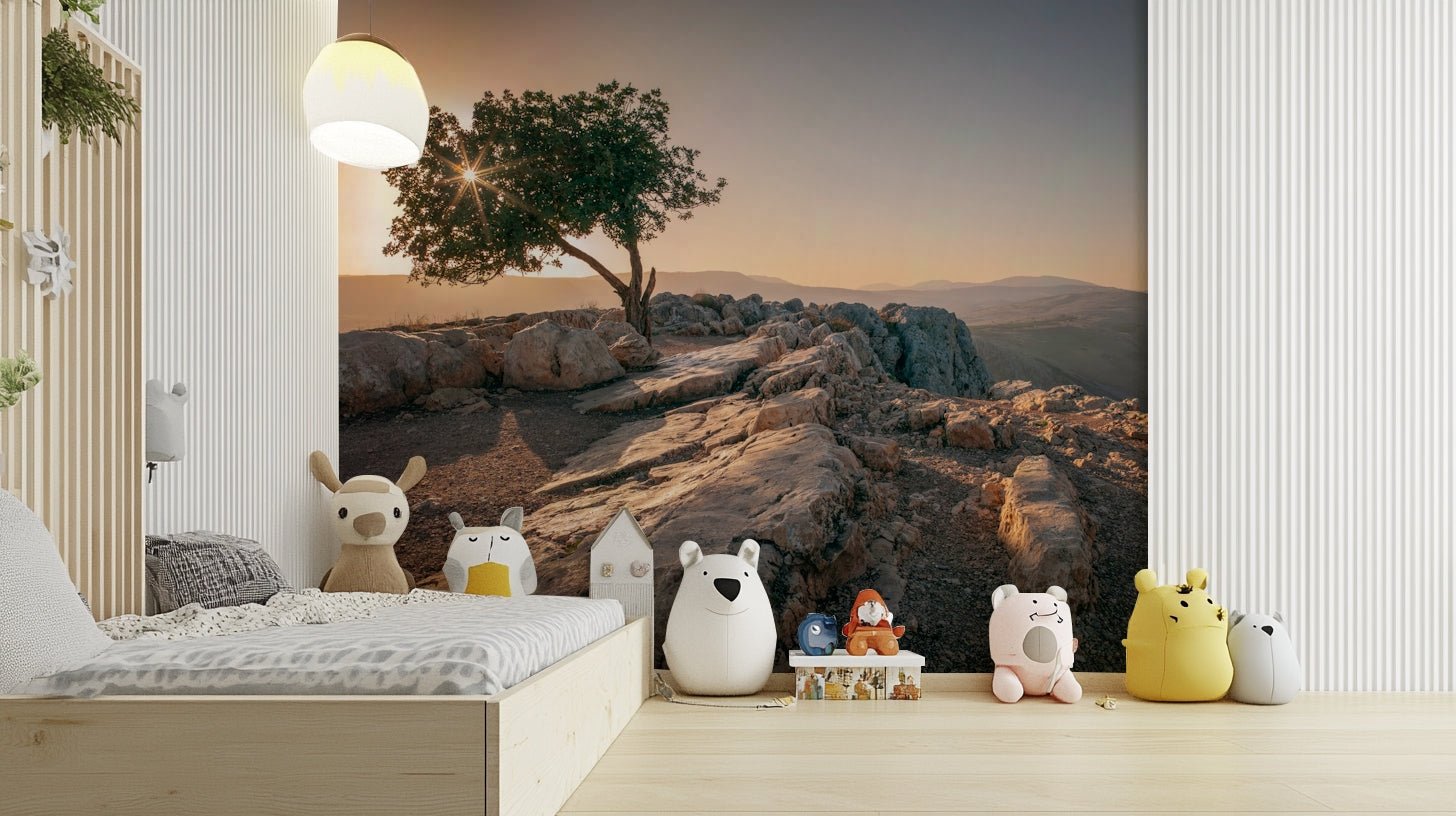 Golden sunset behind a lone tree captured in a wall mural.

