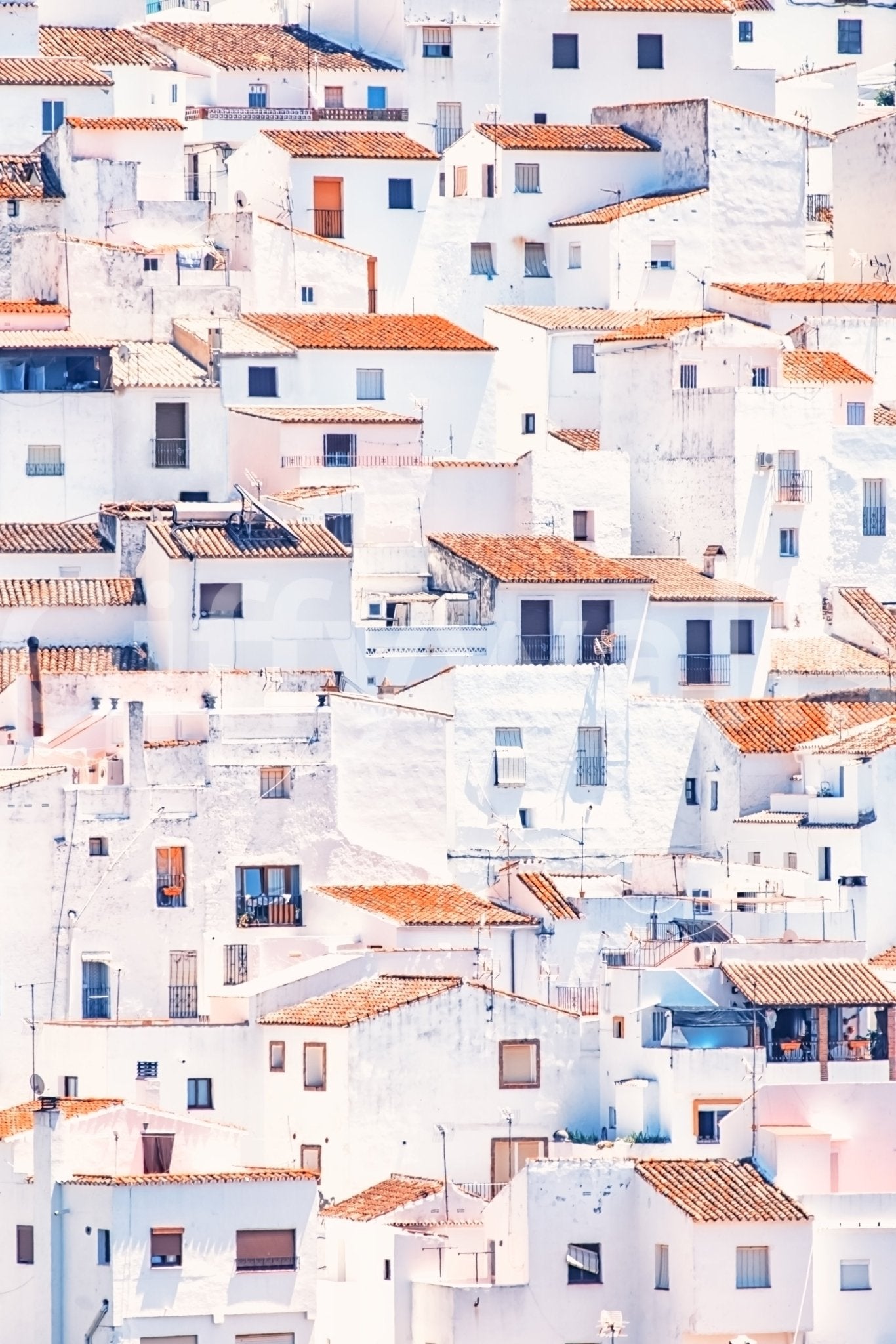 Spanish Townscape mural shown as a full-wall scene of stacked white hillside houses with red tile roofs