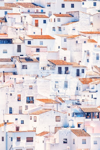 Spanish Townscape mural shown as a full-wall scene of stacked white hillside houses with red tile roofs