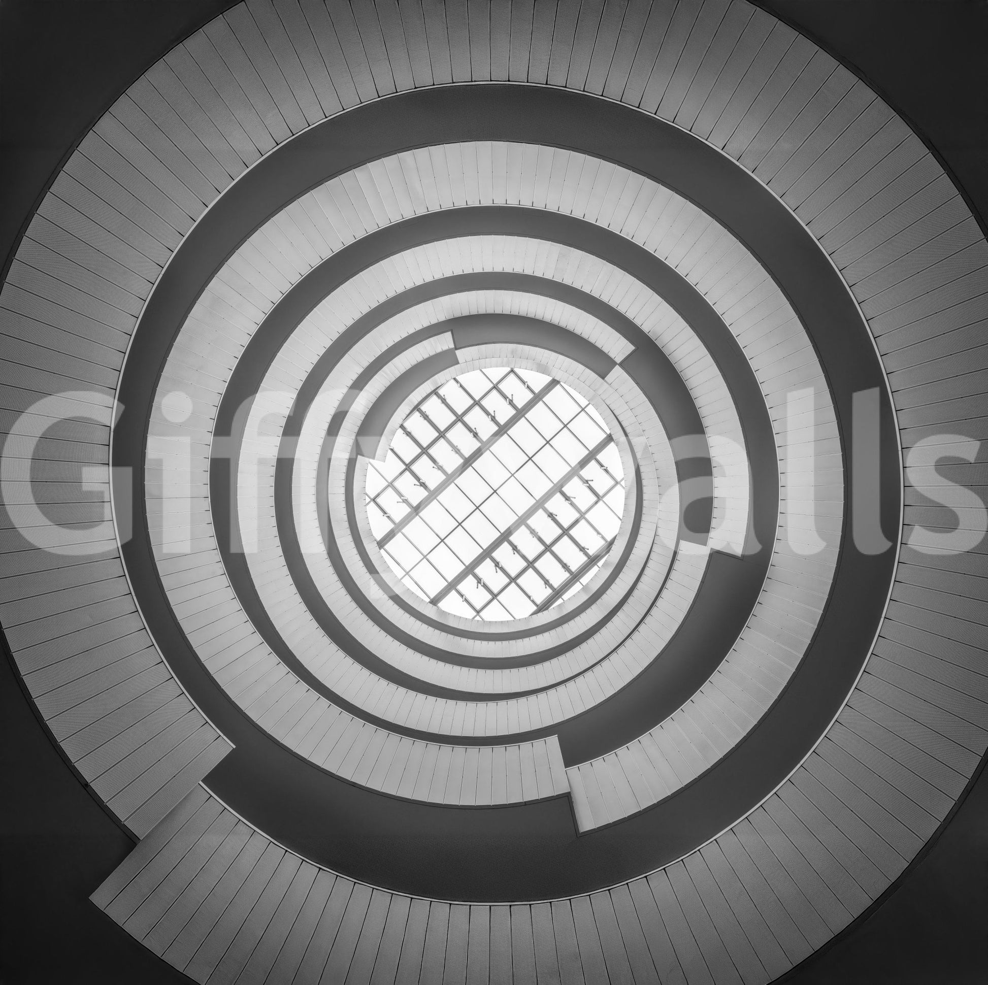 Spiral ascent wall mural with bold lines creating an illusion of depth and motion.