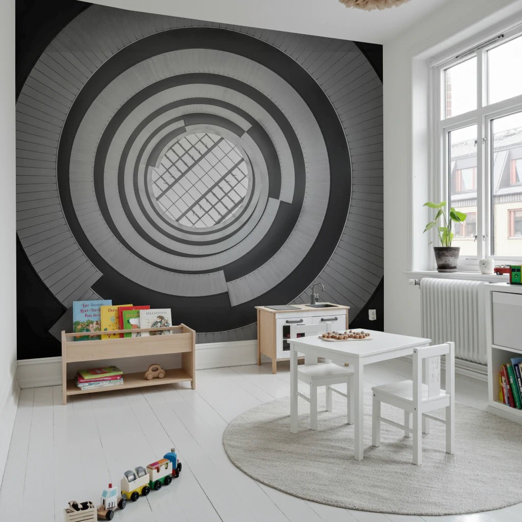 Black and white spiral wall mural enhancing a modern nursery with sleek lines.