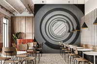 Dynamic spiral staircase mural adding architectural depth to a spacious restaurant.