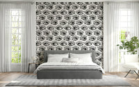 Decorative wall mural with intense staring eyes in grayscale for a dramatic effect.