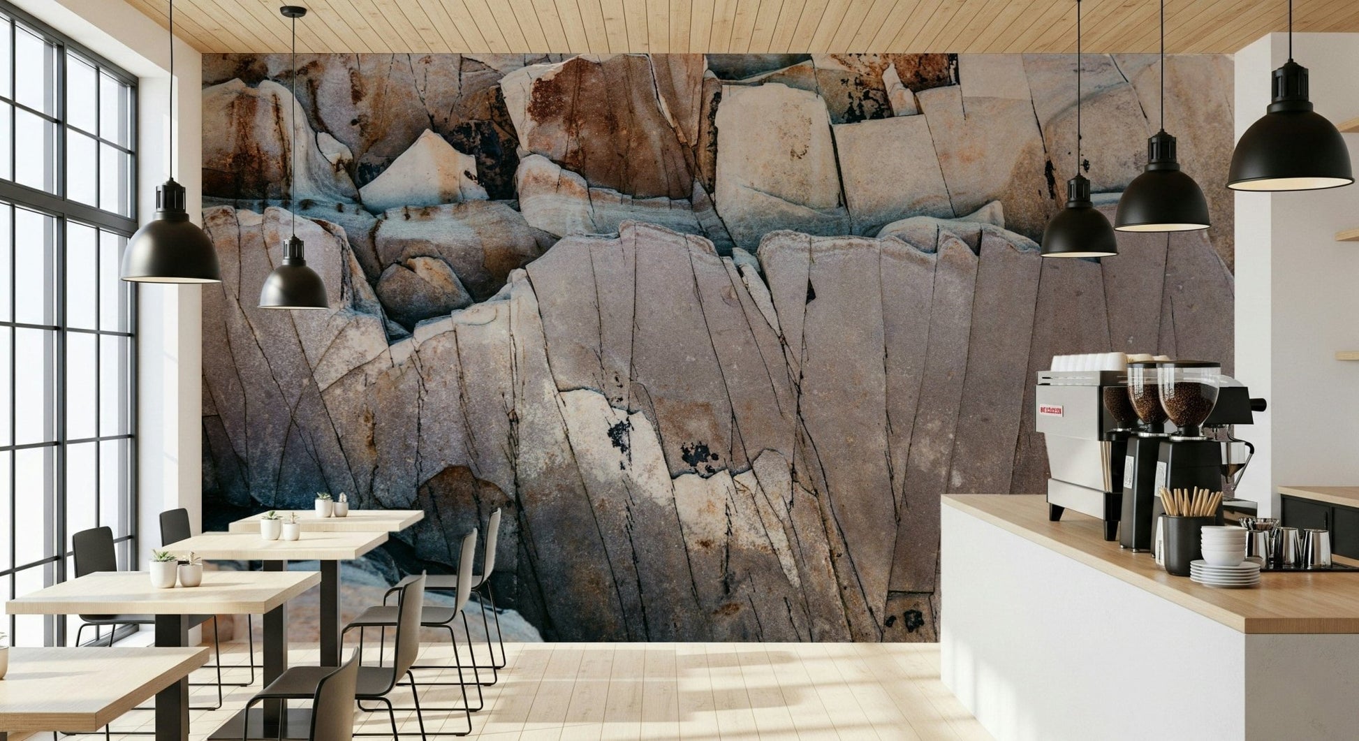 Stone Geometry wallpaper mural of fractured stone in a cafe with espresso machine, black pendants and wood tables