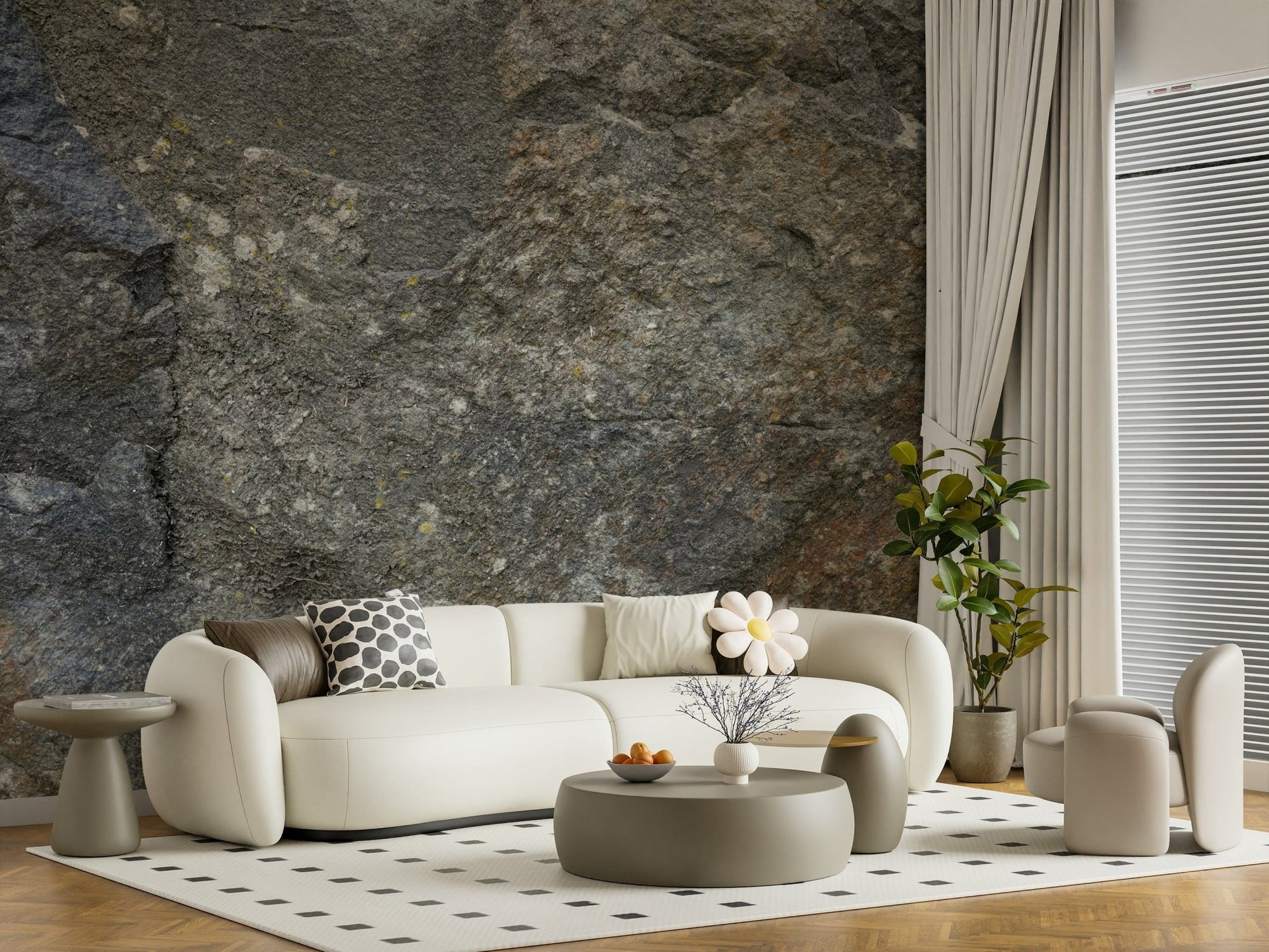 Stone Wall Texture wallpaper mural of grey rock behind a curved cream sofa and sage table in a living room