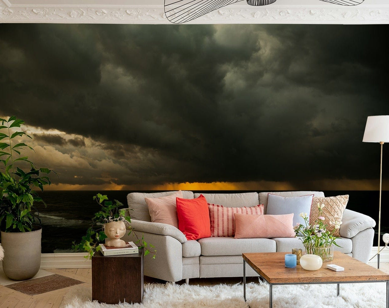 A bedroom with the artistic mural behind the headboard.

