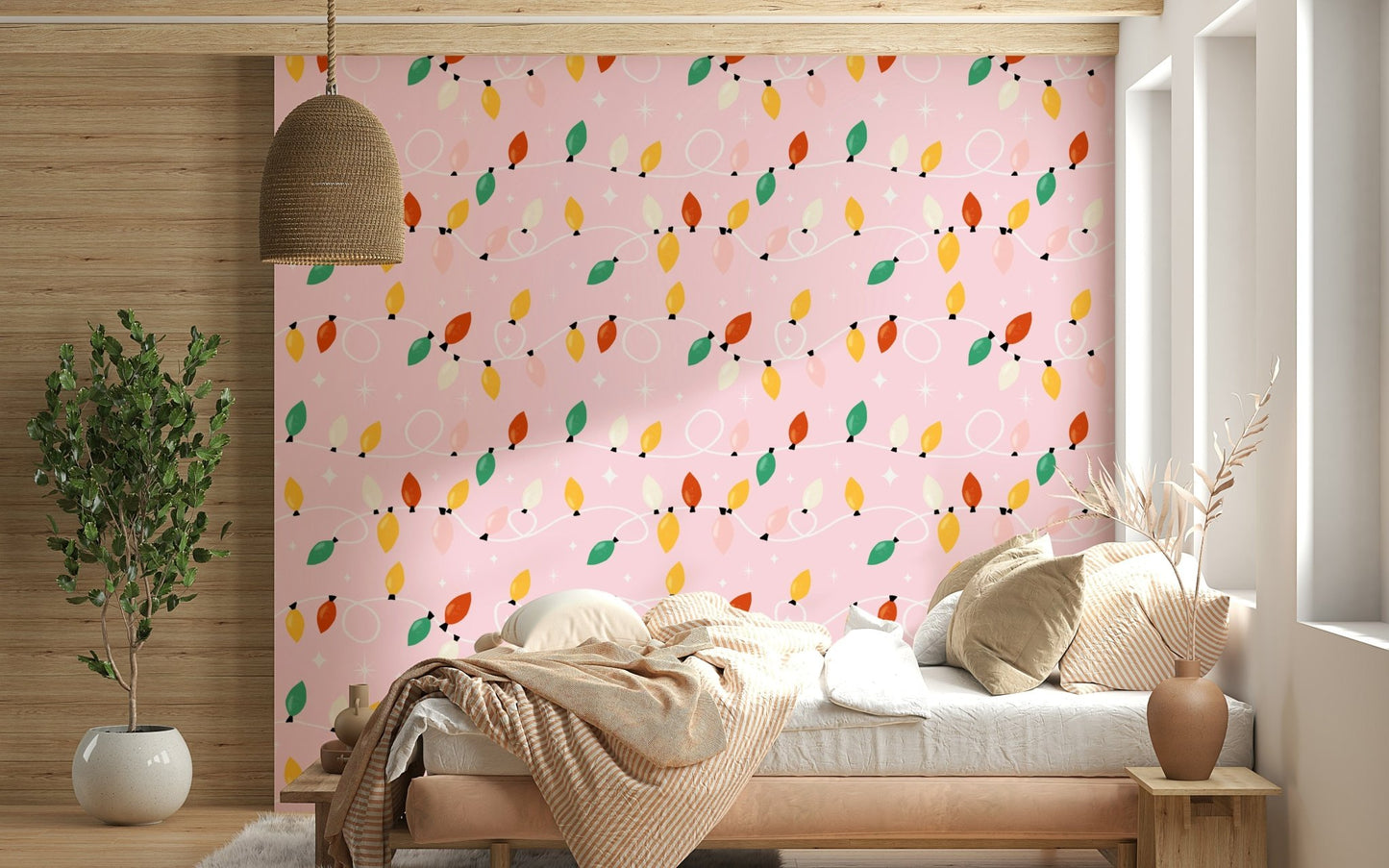Playful string lights in red, yellow, green, and cream looping across a soft pink wallpaper.