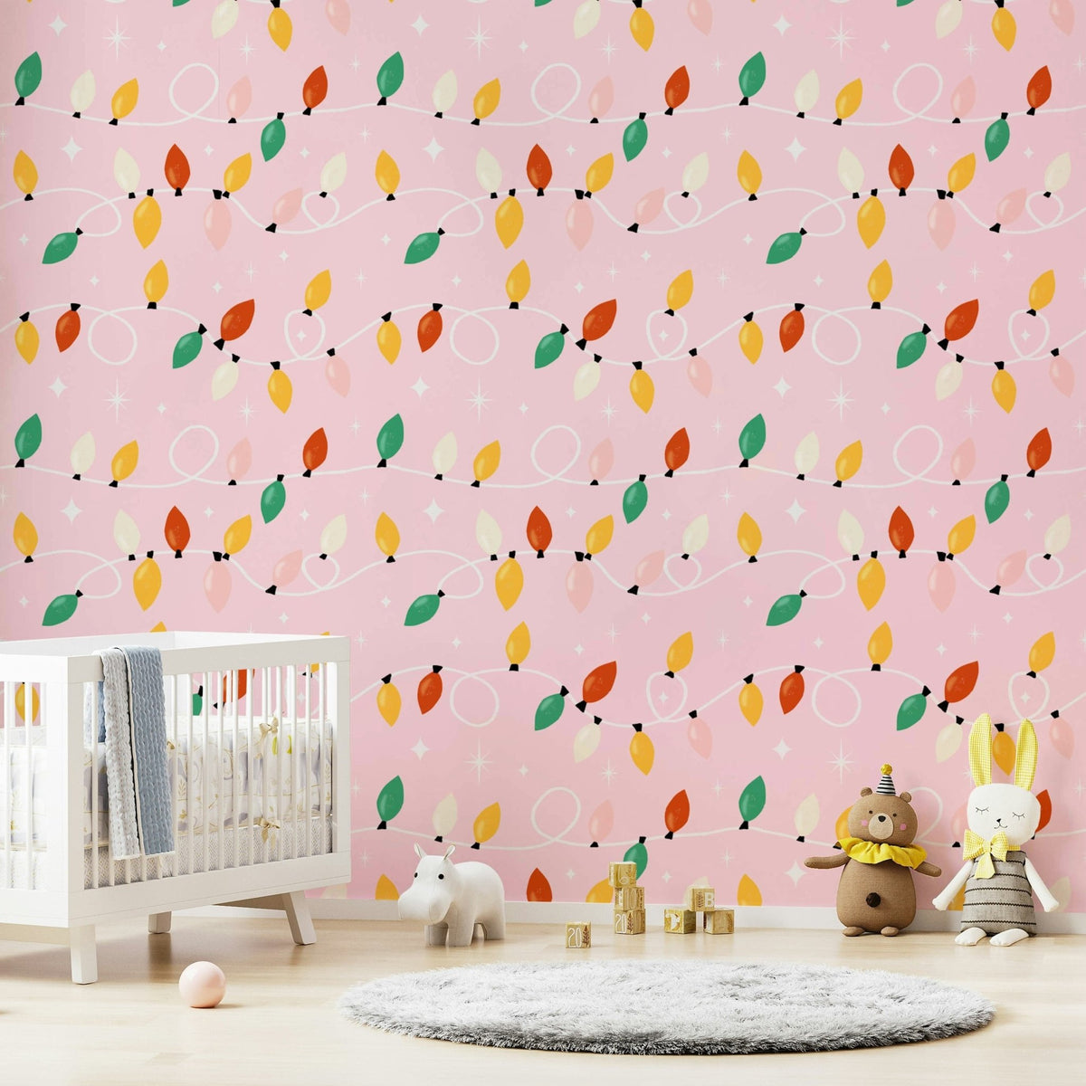 Pink wallpaper showcasing looping holiday lights in warm, vibrant colors with star details.