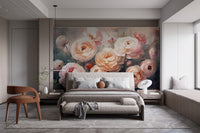 Ranunculus Pink Flower wallpaper mural of peachy-pink blooms behind a grey upholstered bed in a bedroom