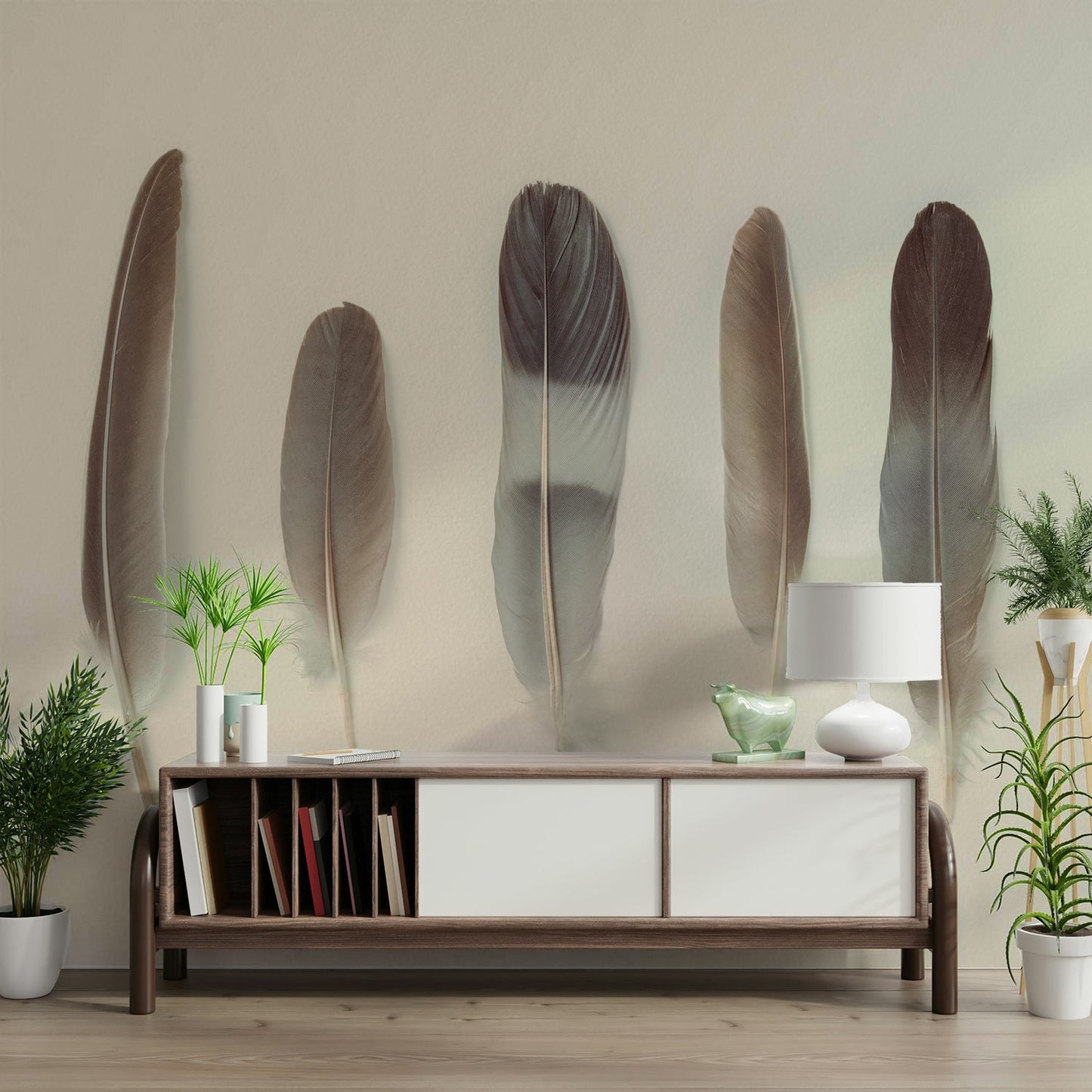 The image shows five feathers of varying sizes.

