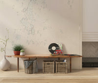 Subtle Texture wallpaper mural in cream plaster behind a wood bench with vinyl records and woven baskets