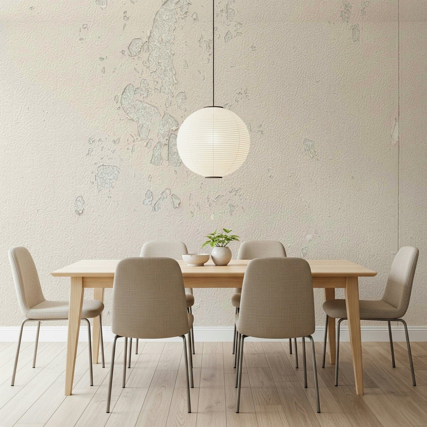 Subtle Texture wallpaper mural in cream plaster behind a wood dining table and paper globe pendant